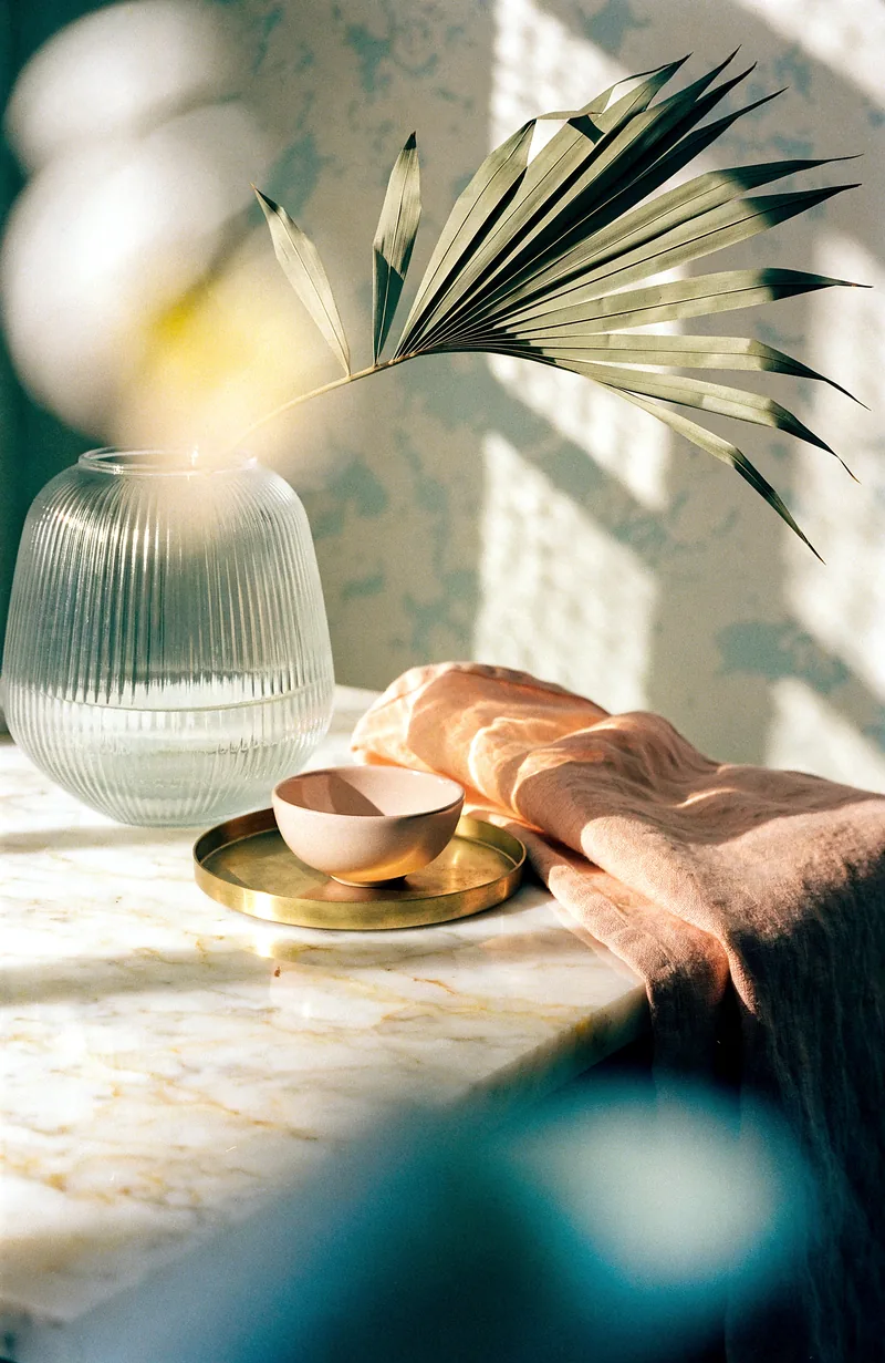 Styling detail with glassware and dried botanicals.
